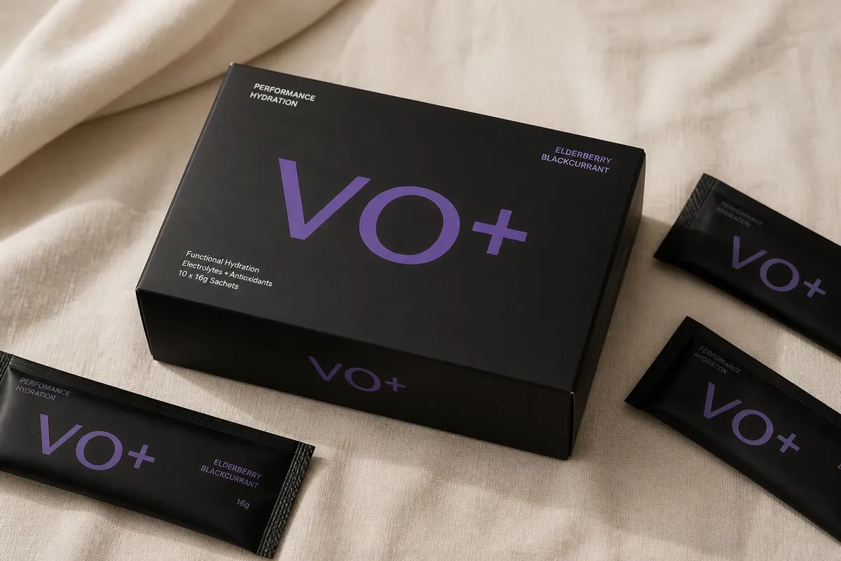 VO+ matte black box with purple lettering, surrounded by black sachets