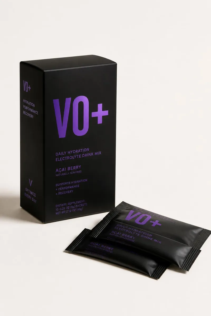 VO+ matte black box with purple lettering, surrounded by black sachets